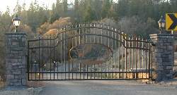 Automatic Entry Gate With A Plasma Cut Out, Brick Columns And Lights